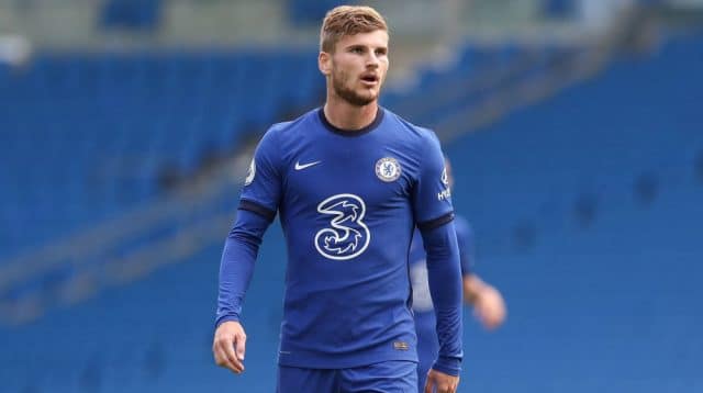 Timo Werner looks on in a chelsea shirt