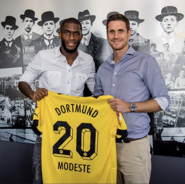 Anthony Modeste is presented with a BVB jersey number 20