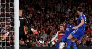 Aaron Ramsey scores past Kasper Schmeichel in a Premier League game